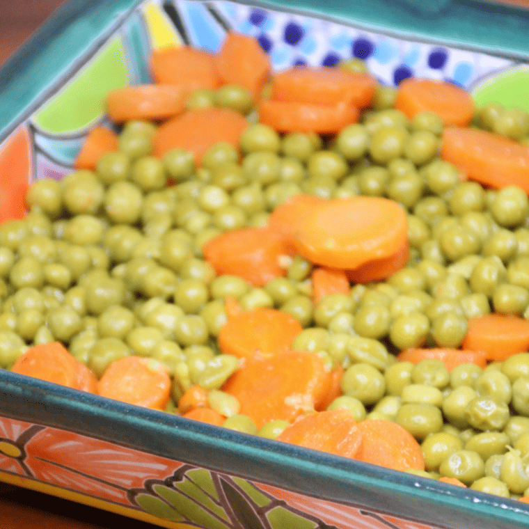 "Fresh peas and carrots cooked in an air fryer"