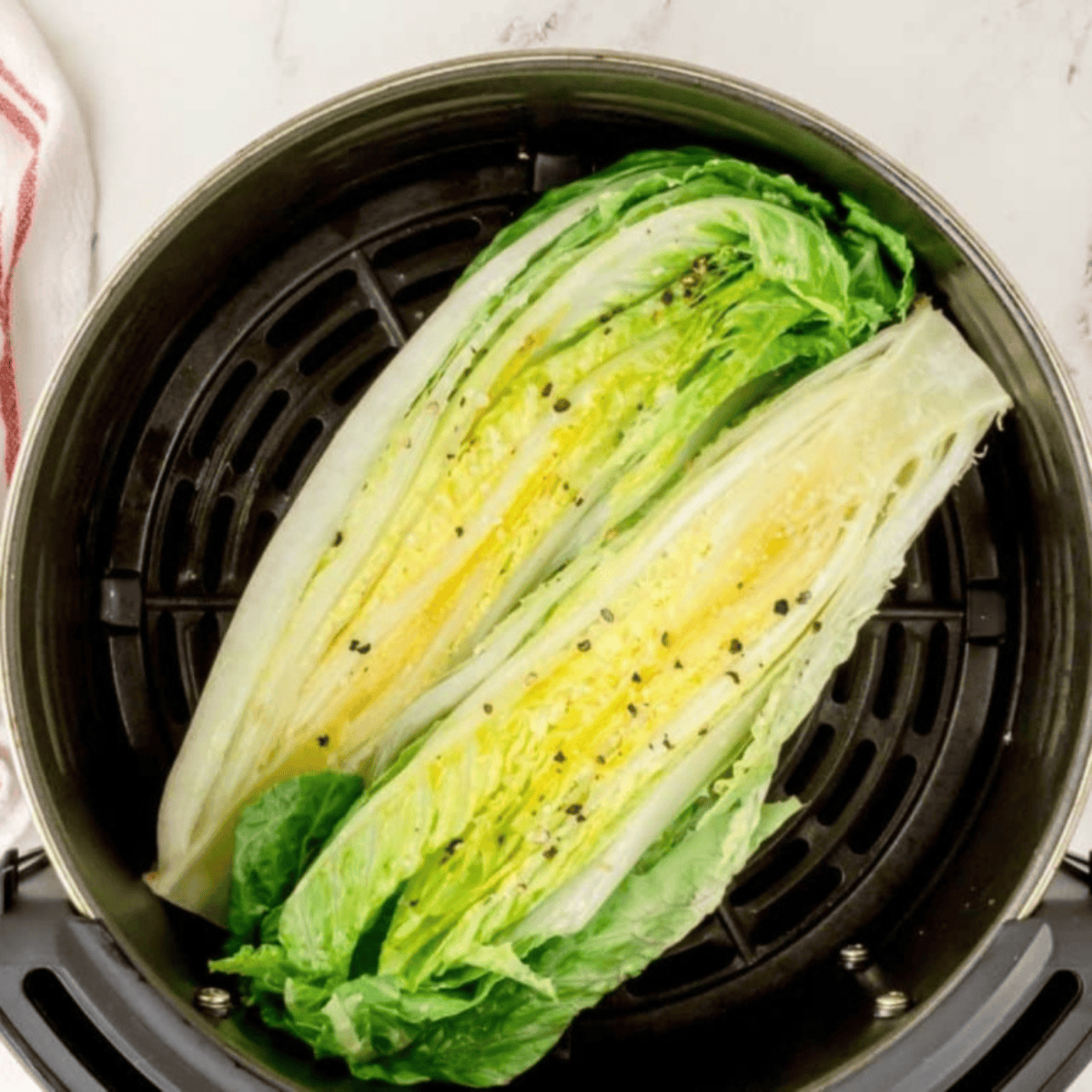 Place lettuce into the air fryer basket.