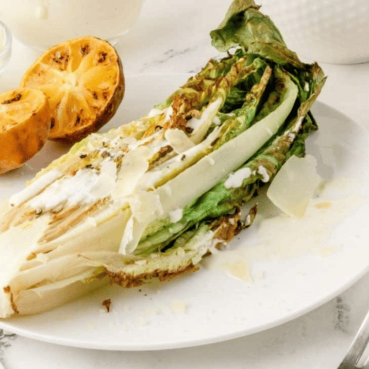 Air Fried Romaine Lettuce with crispy, charred edges served as a fresh, smoky side dish.