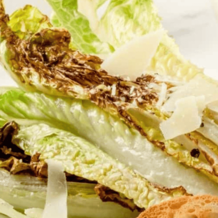 Air Fryer Romaine Lettuce with crispy, smoky edges, served as a fresh and healthy salad twist.