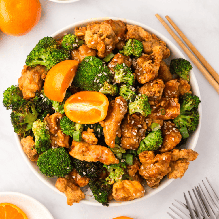 crispy orange chicken and broccoli cooked in air fryer basket