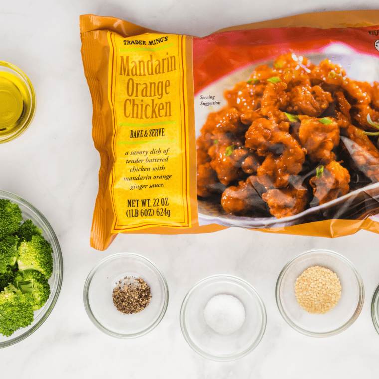 preheating air fryer and placing frozen orange chicken in basket single layer