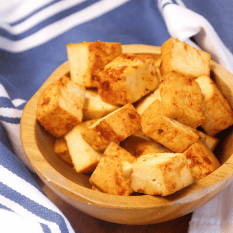 Crispy Air Fryer Trader Joe's Sriracha Tofu Bites served on a plate, golden brown with a spicy glaze.