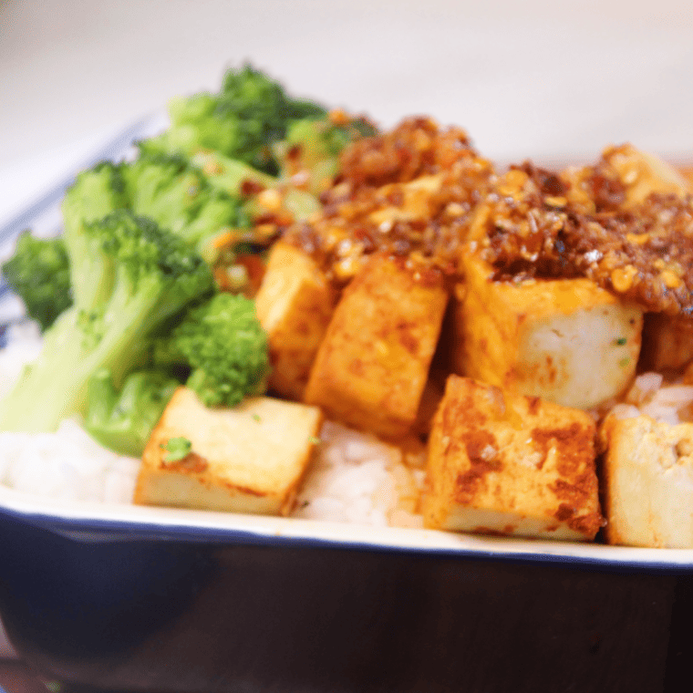 Air-fried Trader Joe’s Sriracha Tofu Bites, crispy and golden brown, served on a plate.