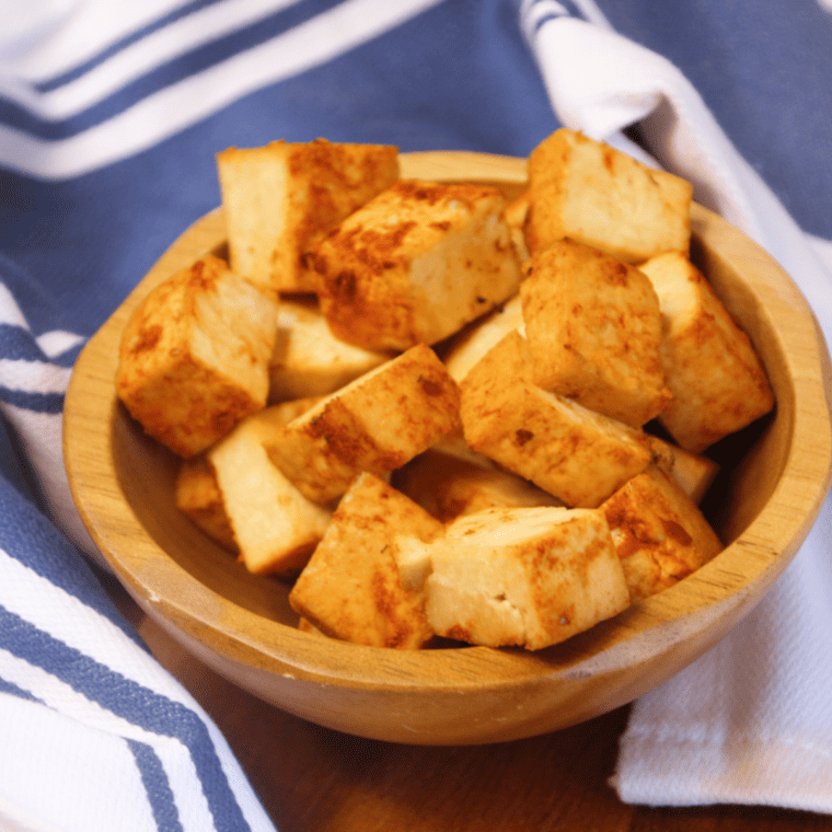 Crispy Air Fryer Trader Joe's Sriracha Tofu Bites served on a plate with dipping sauce.