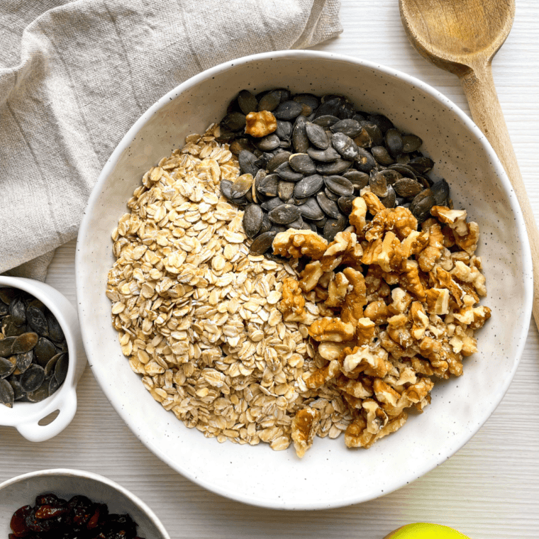 Vanilla granola ingredients in a bowl reading for mixing.