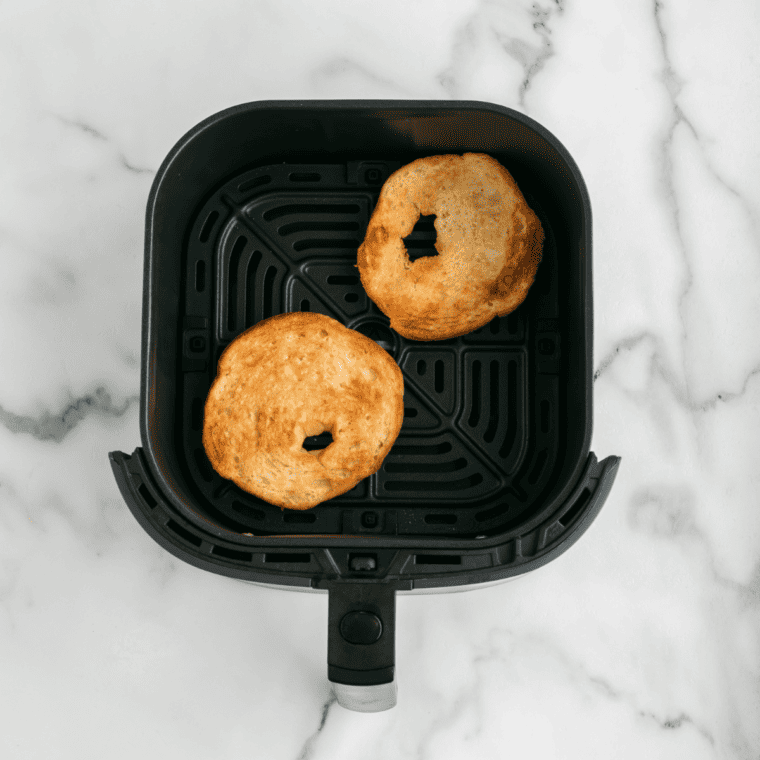 Toasting the croissant halves until golden brown