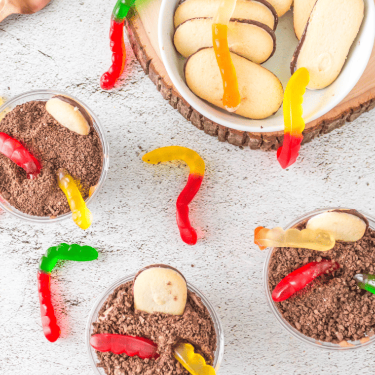 Step-by-step assembly of Dirt Cups with chocolate pudding, crushed Oreos, and gummy worms