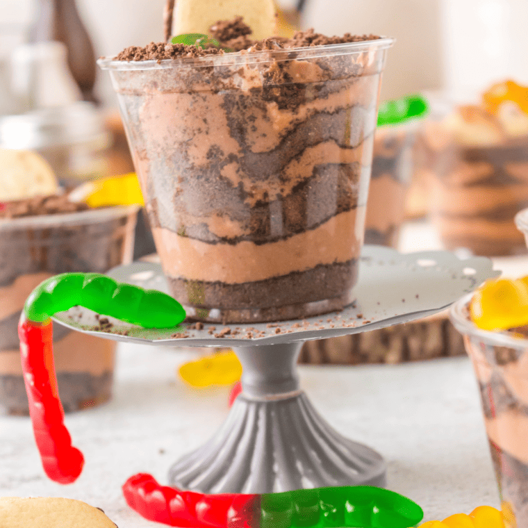 Close-up of Dirt Cups with chocolate pudding, crushed Oreos, and gummy worms