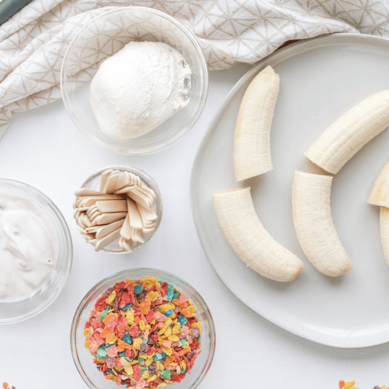 Ingredients needed for Fruity Pebbles Banana Pops on kitchen table.