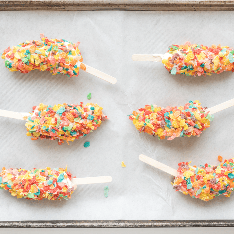 Frozen Fruity Pebbles Banana Pops ready to eat as a colorful, refreshing treat.