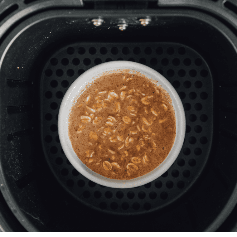 Add leftover oatmeal in air fryer basket leaving space around the oatmeal for reheating