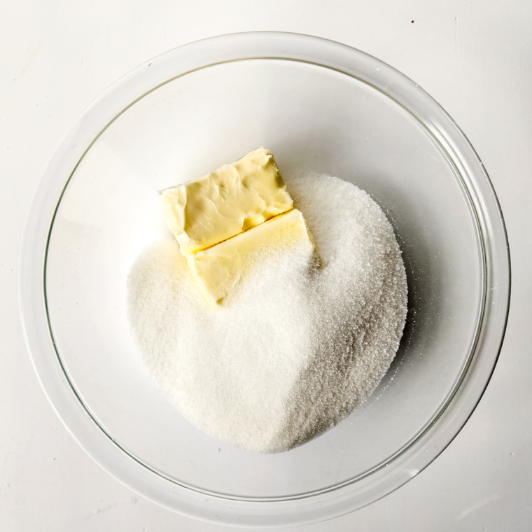 Softened butter and sugar creamed in a large bowl, eggs and vanilla being mixed in, then sour cream added