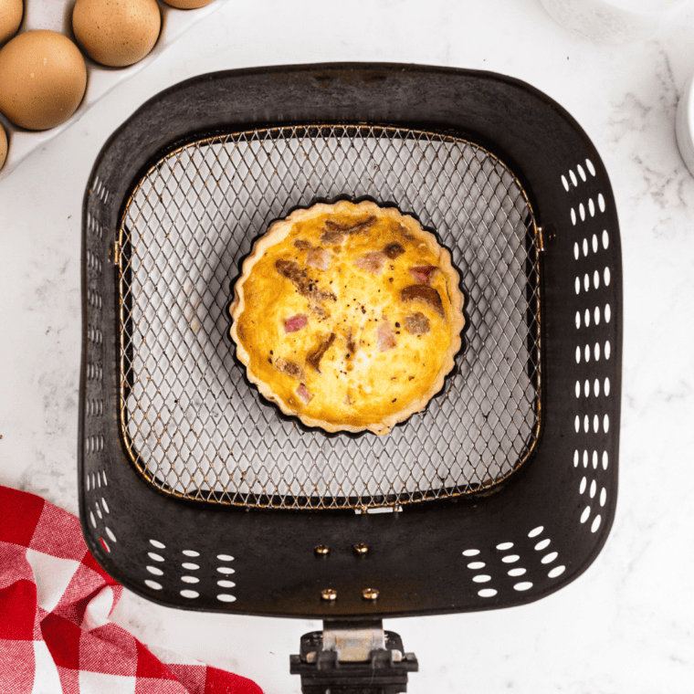 Fully cooked Meat Lover's Quiche in the air fryer basket.