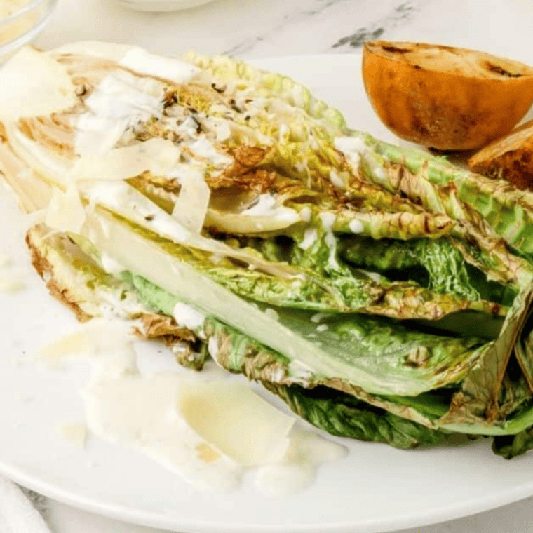 Air Fryer Romaine Lettuce with crispy, charred edges served on a plate, perfect for salads or a side dish.