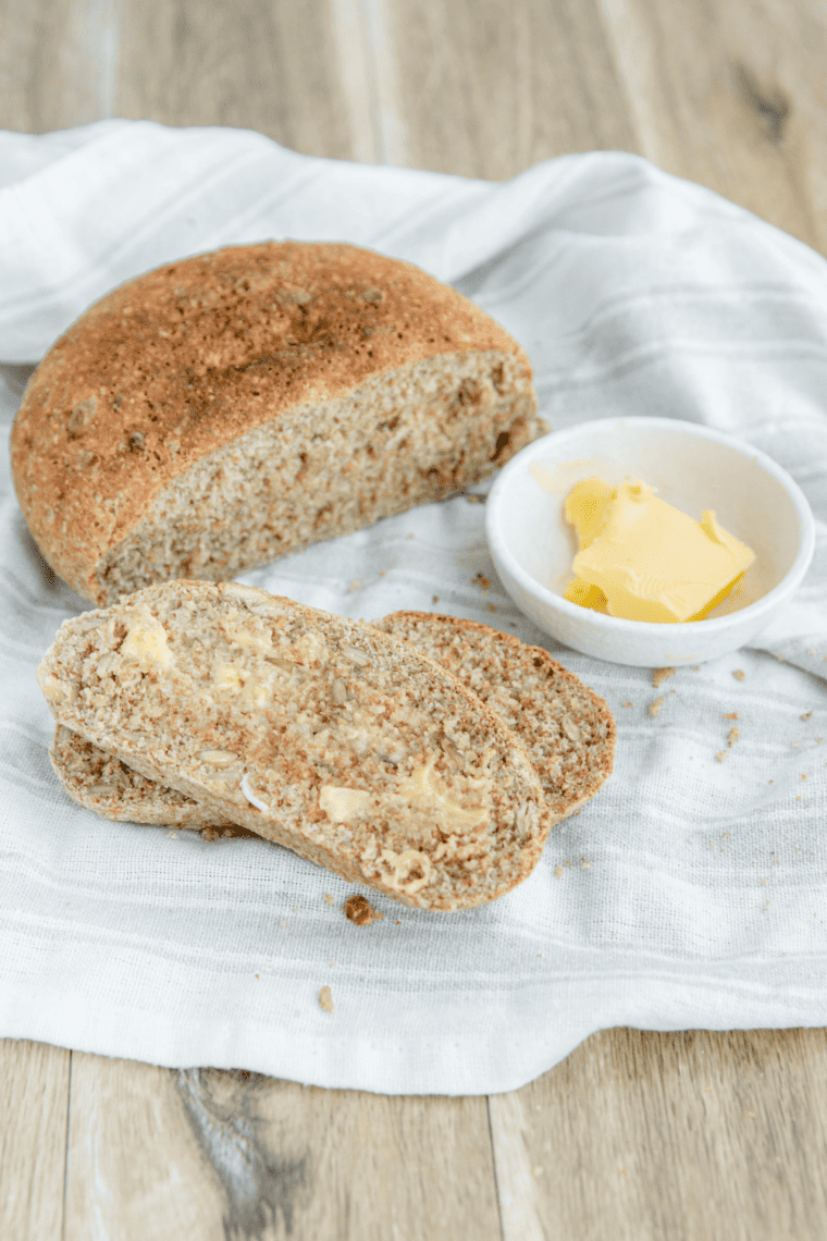Freshly baked air fryer whole wheat bread loaf cooling on a wire rack