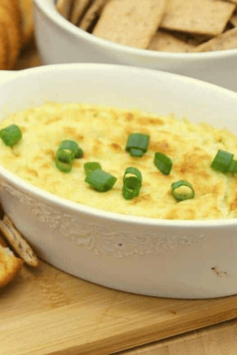 Close up of Artichoke Dip on crackers.