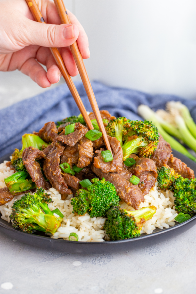 Air Fryer Beef and Broccoli served with tender beef, crispy broccoli, and a savory sauce, garnished with fresh scallions.