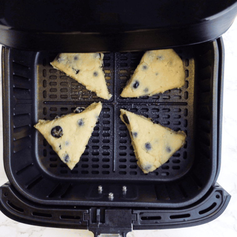 Scones air frying until golden brown, then cooling on a wire rack