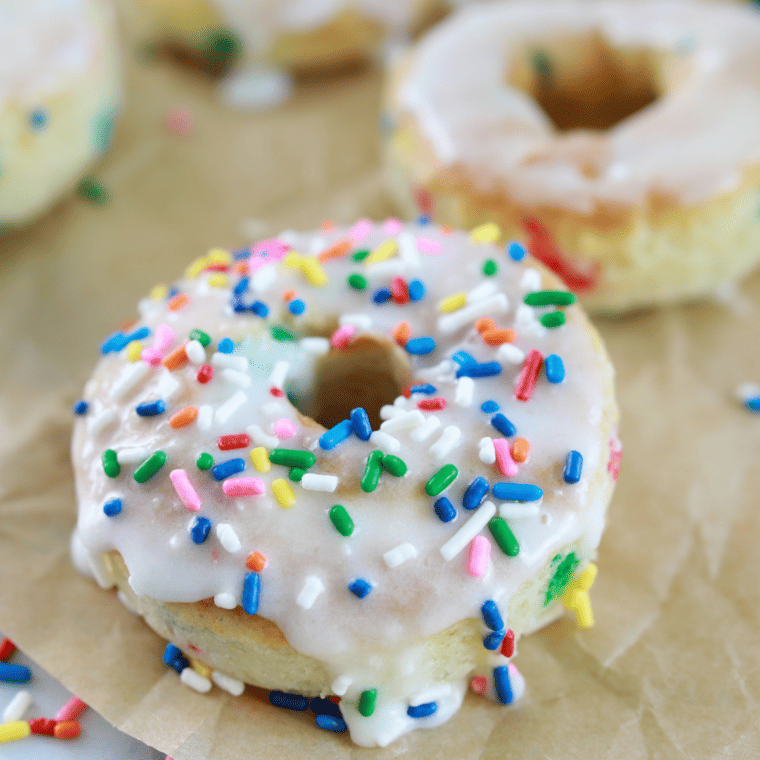 Funfetti cake mix donuts cooling on a wire rack