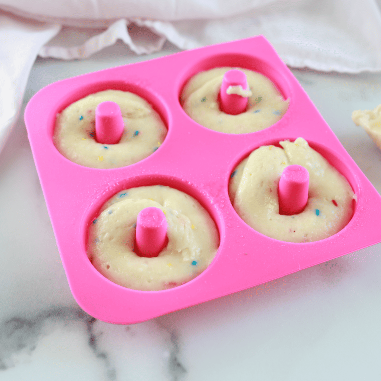 Whisking Funfetti cake mix batter until smooth