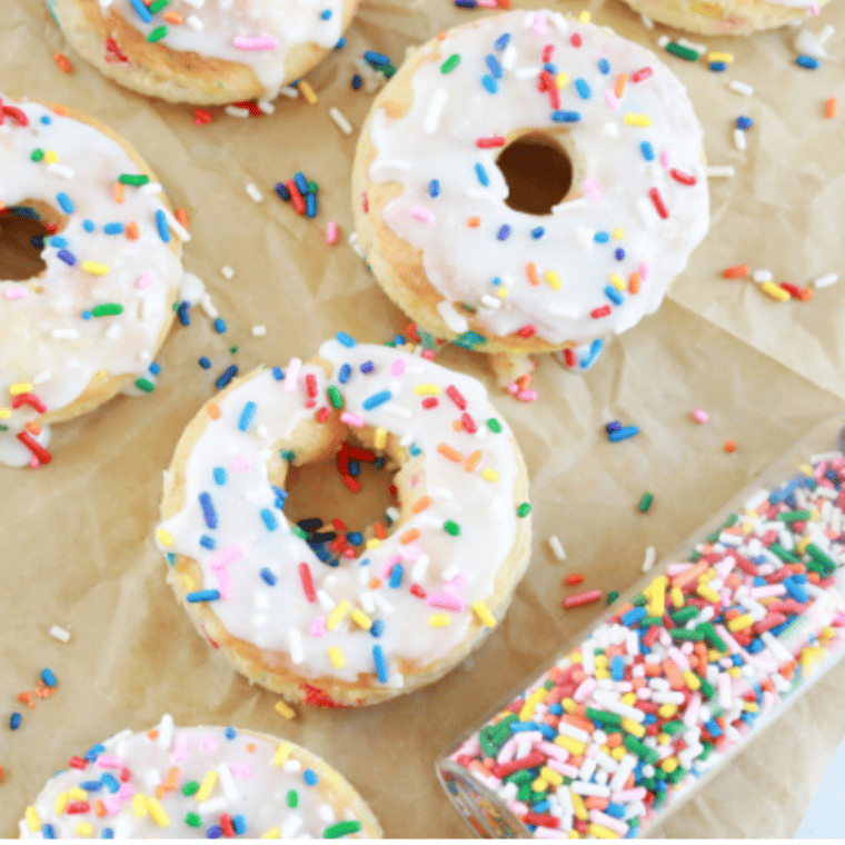 Funfetti donuts air frying in a donut pan at 320°F