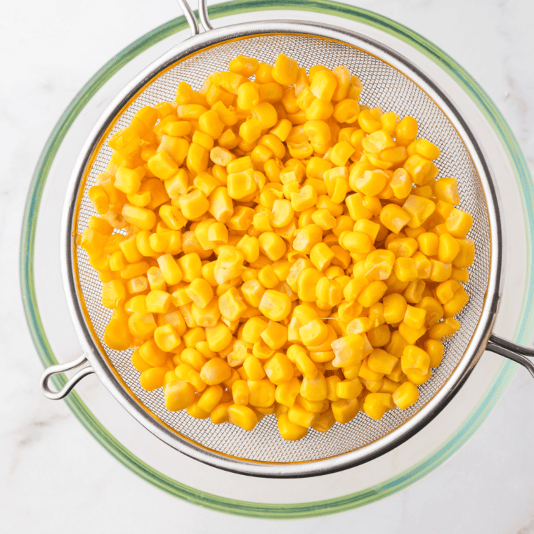 Drain and rinse corn, in a strainer. 