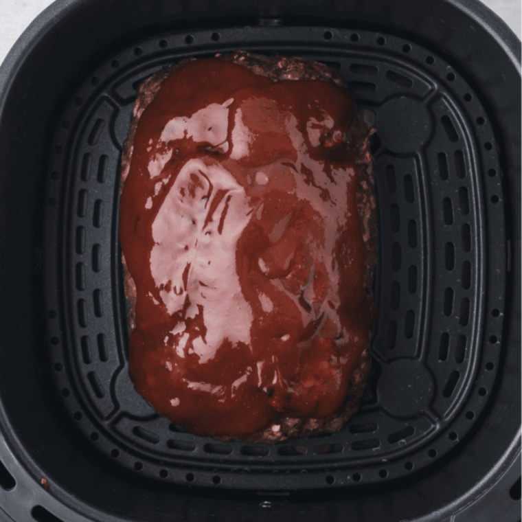 The air fryer cooking the chicken meatloaf, with the timer visible on the display.