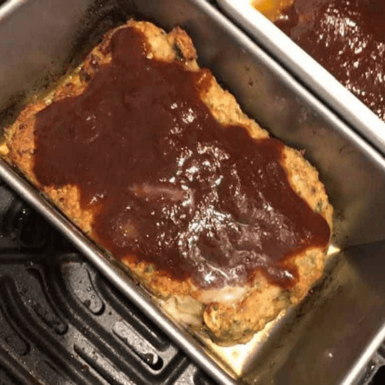 Shape the Meatloaf: Shaping the meatloaf mixture into a loaf shape on a piece of parchment paper.