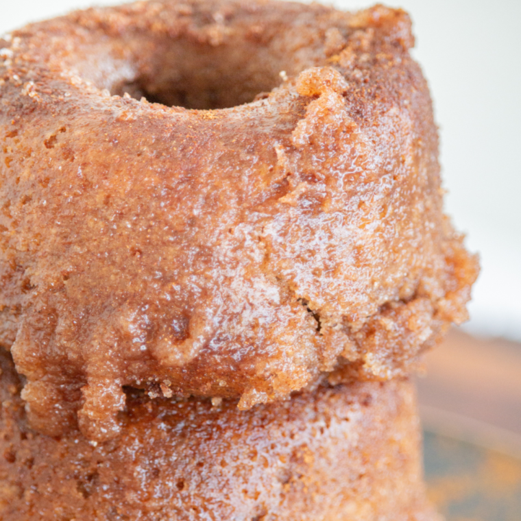 Close-up of golden Air Fryer Churro Donuts dusted with cinnamon and sugar