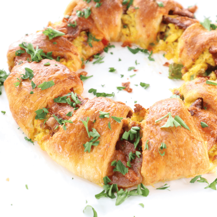 Air fryer crescent breakfast ring with eggs, cheese, and sausage, golden brown