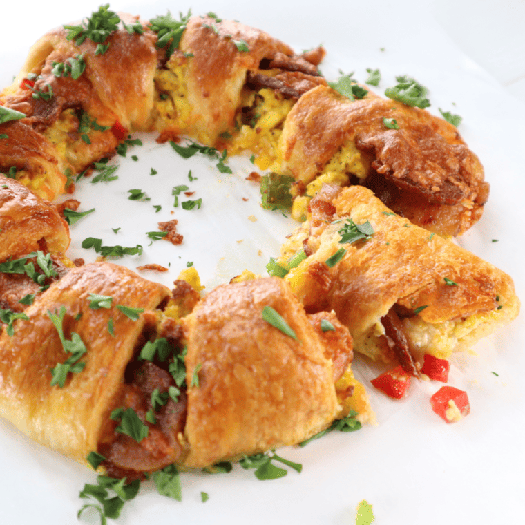 Golden crescent breakfast ring with eggs, bacon, peppers, and cheese