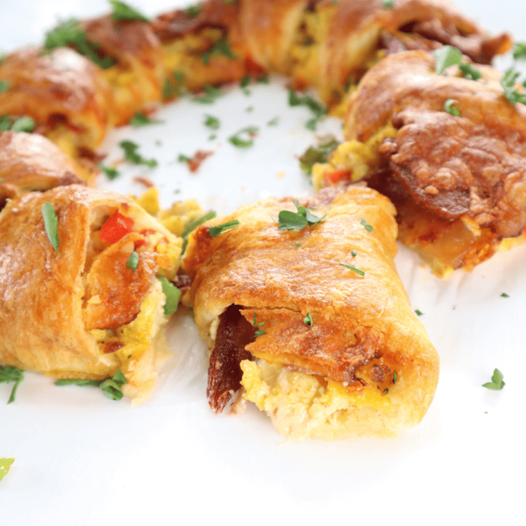 Air fryer crescent breakfast ring with eggs, cheese, and sausage, golden brown