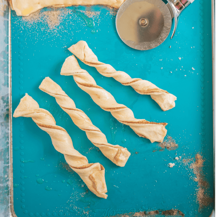 Crescent roll dough unrolled and cut into thin strips with a pizza cutter