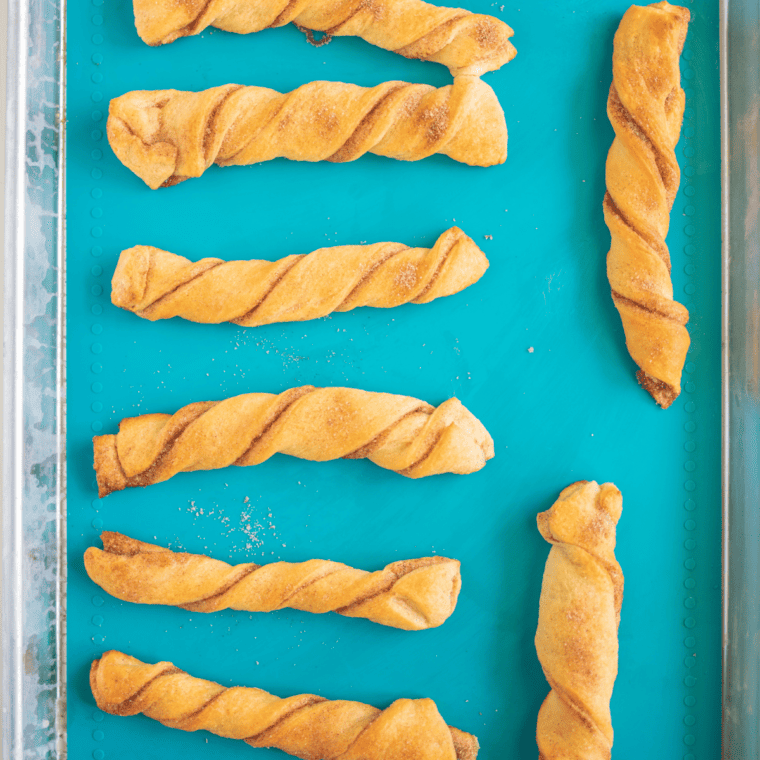 Strips of crescent dough twisted into churro shapes before air frying