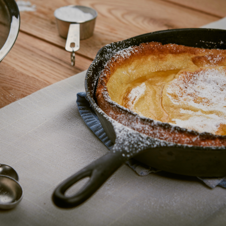 Golden puffed air fryer Dutch baby pancake in skillet style pan