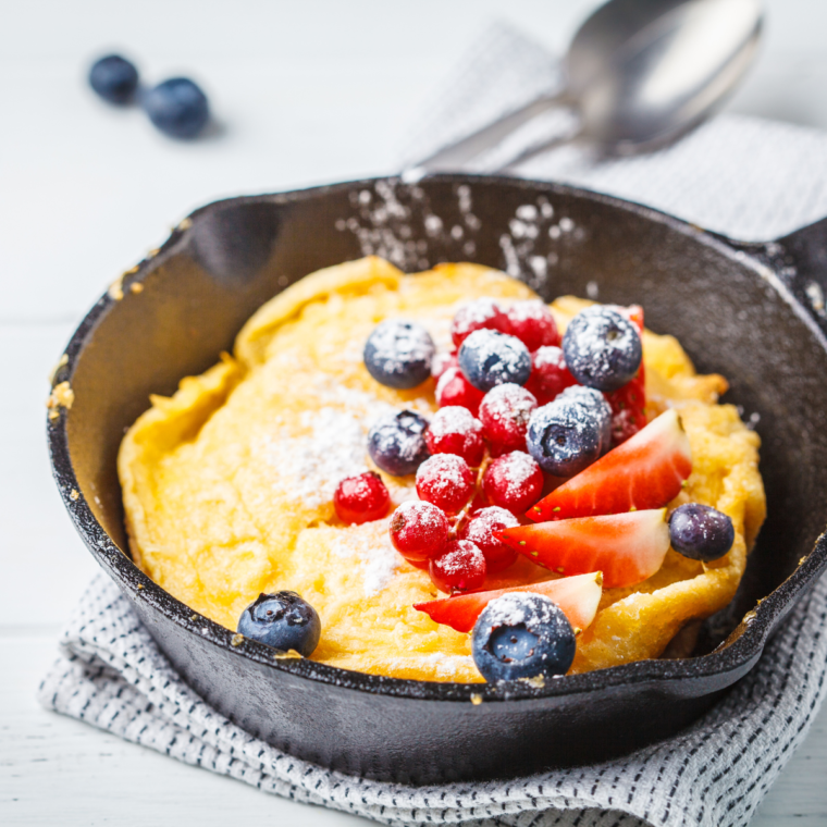 Golden air fryer Dutch baby pancake with powdered sugar