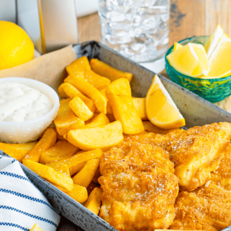 Crispy air-fried fish fillets served with golden fries, lemon wedges, and creamy homemade tartar sauce.