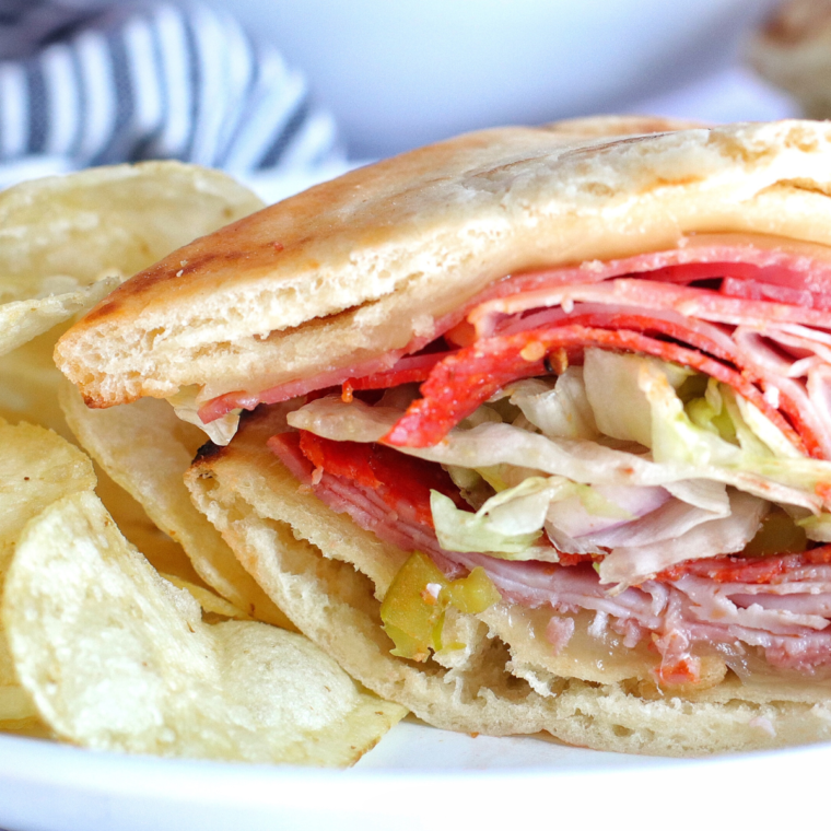 Air Fryer Flatbread Sandwich loaded with cheese, fresh veggies, and protein