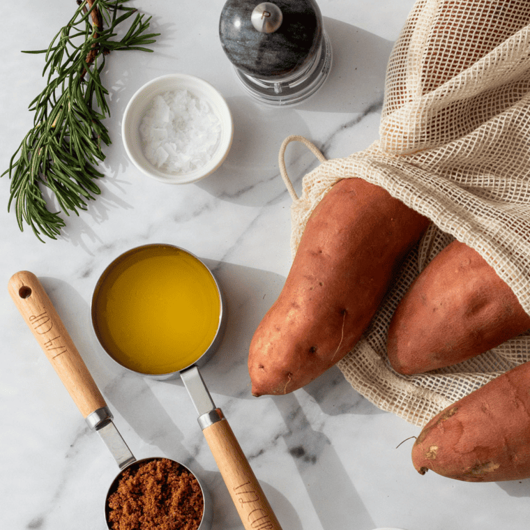 Ingredients Needed For Air Fryer Hasselback Sweet Potatoes on marble table.