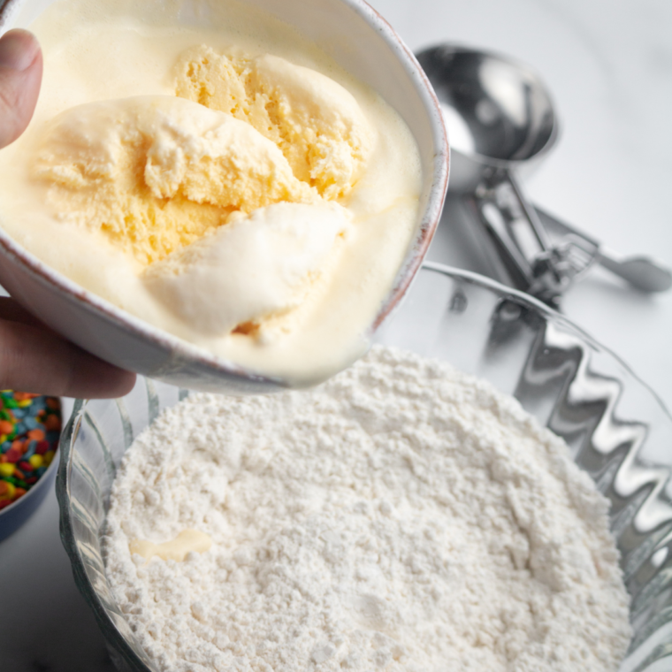 Softened ice cream in a bowl, ready to be mixed for bread