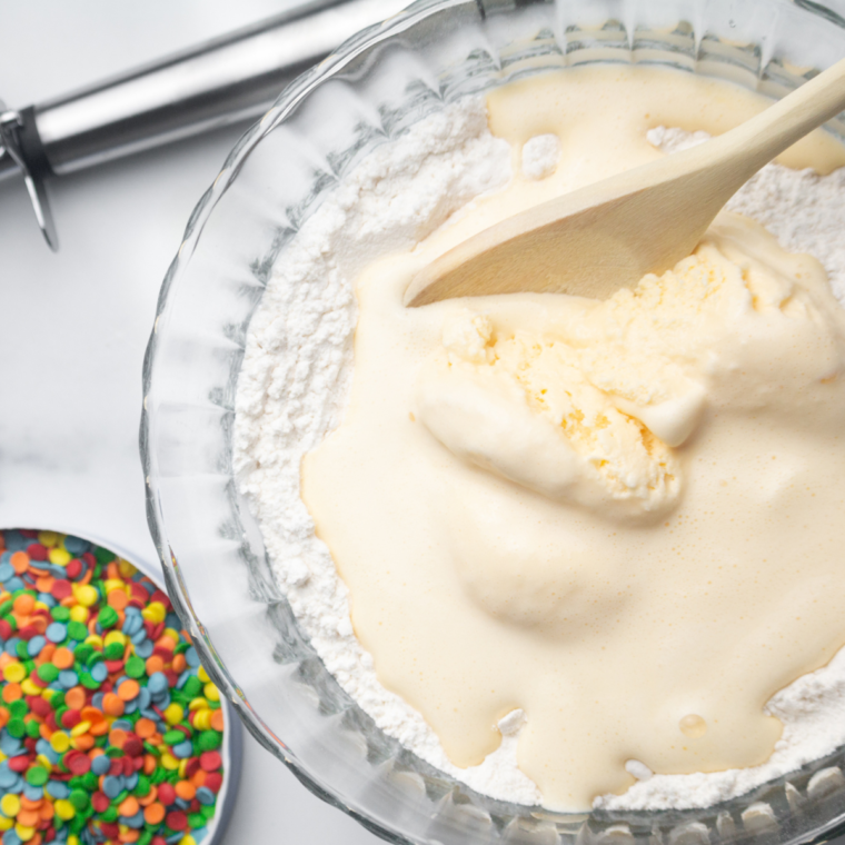Mixing melted ice cream with self-rising flour to form smooth batter