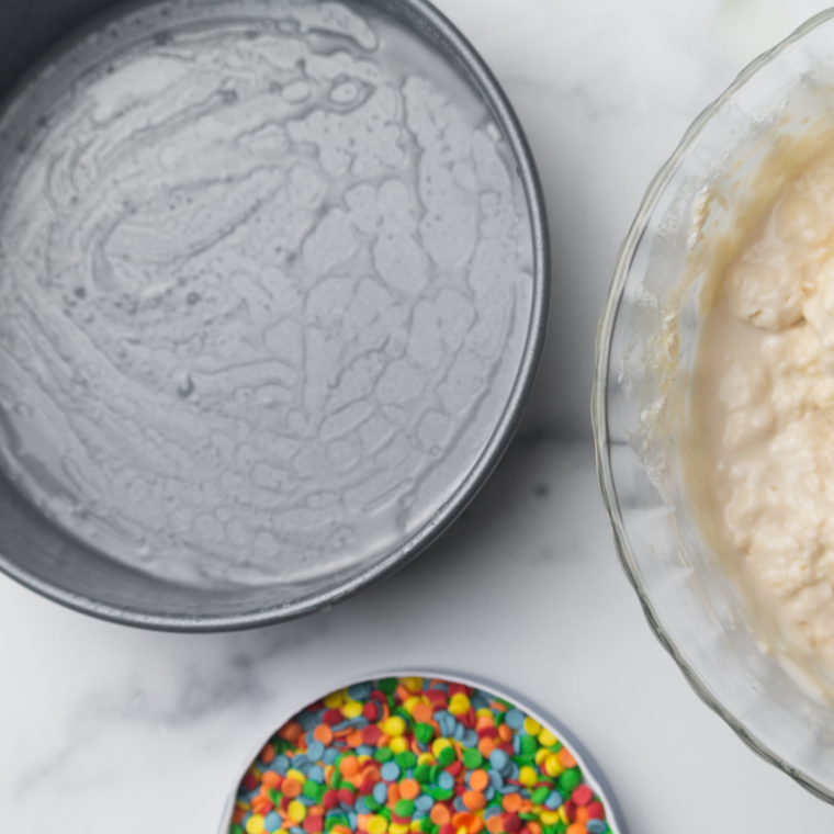 Ice cream bread batter poured into a greased loaf pan ready for air fryer