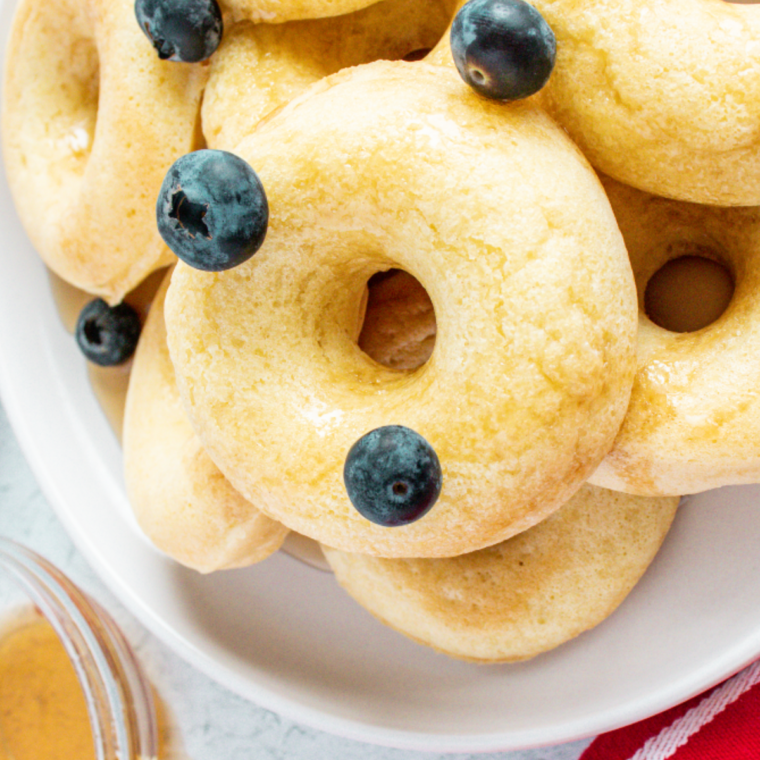 Air fryer donut shaped pancakes crisp edges and soft fluffy center.