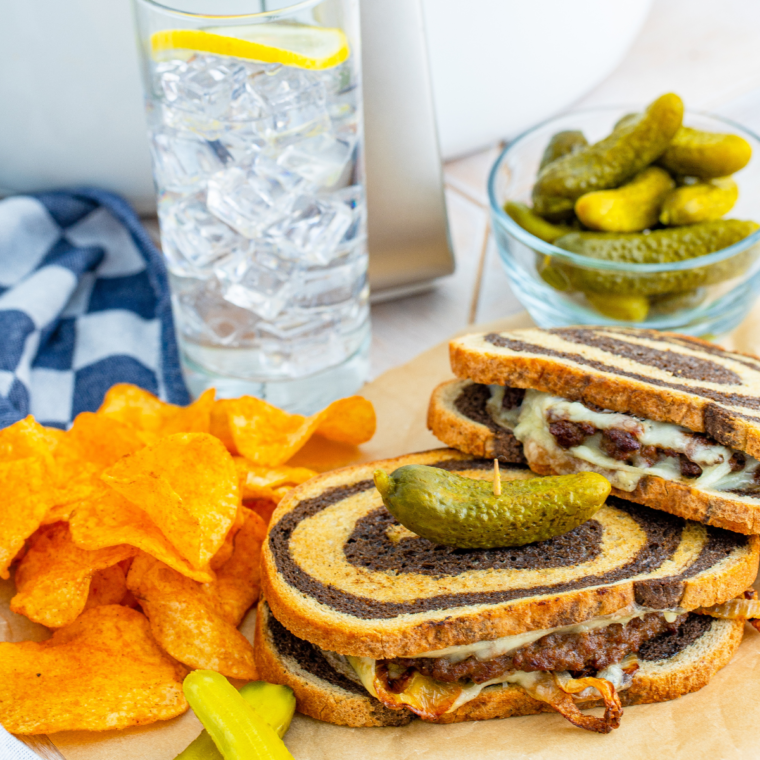 Air fryer patty melt with caramelized onions, Swiss cheese, and rye bread, cooked to crispy perfection.