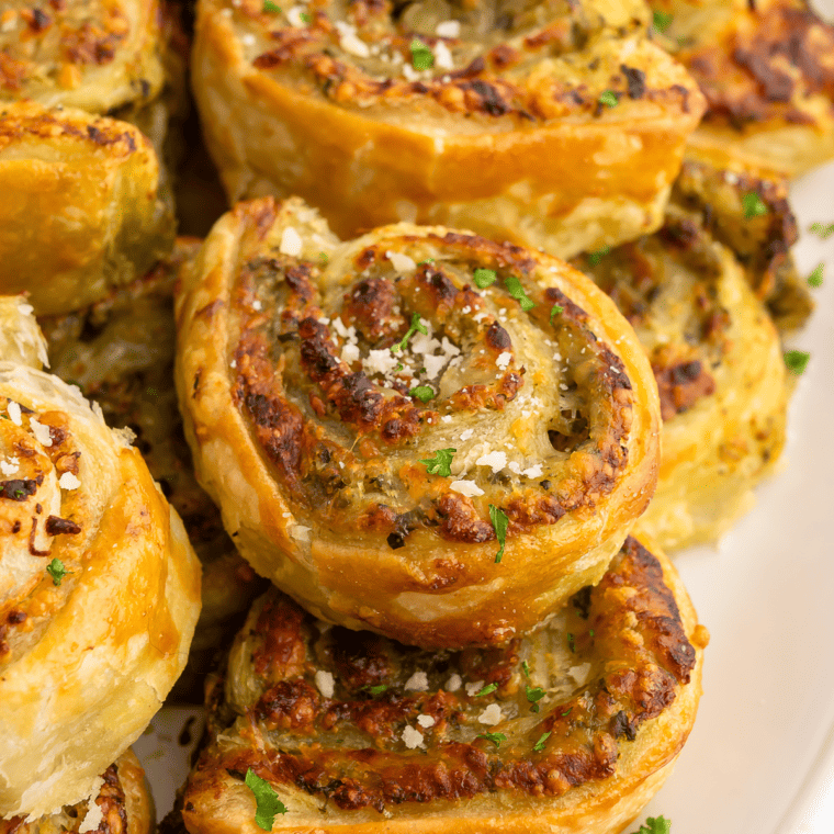 Close-up of Air Fryer Pesto Pinwheels filled with savory pesto and cheese.