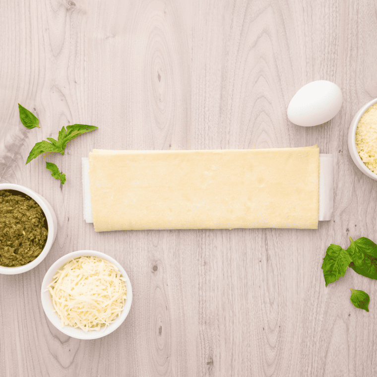 Ingredients Needed For Air Fryer Pesto Pinwheels on kitchen table.