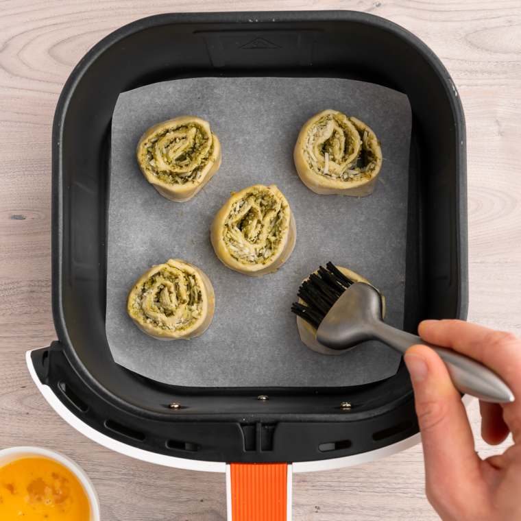 Freshly cooked Air Fryer Pesto Pinwheels with a golden, crispy texture."