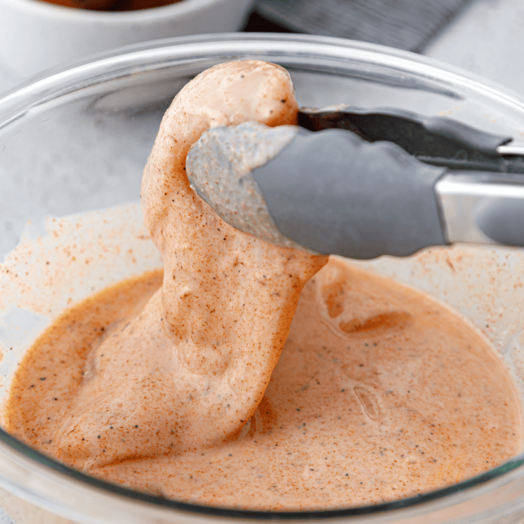 Whisk together buttermilk, cornstarch, and blackening spice in a bowl, then coat chicken and refrigerate for 1 hour.