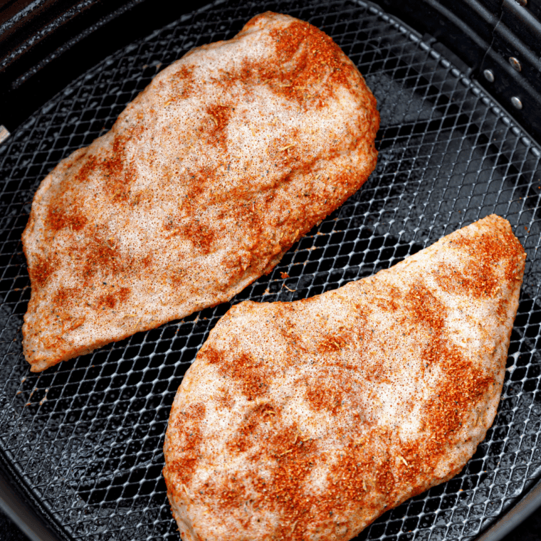 Coat chicken with blackening spice, spray with vegetable oil, and place in air fryer basket.